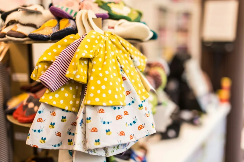 Colorful children’s clothing displayed on hangers