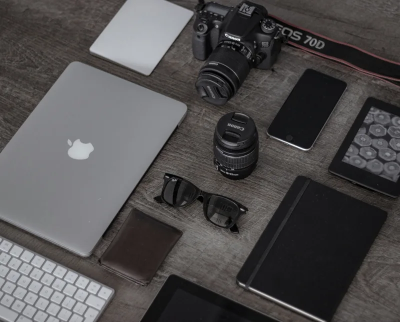 A laptop, camera, tablet, and everyday electronics